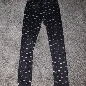 black leggings with little purple bows